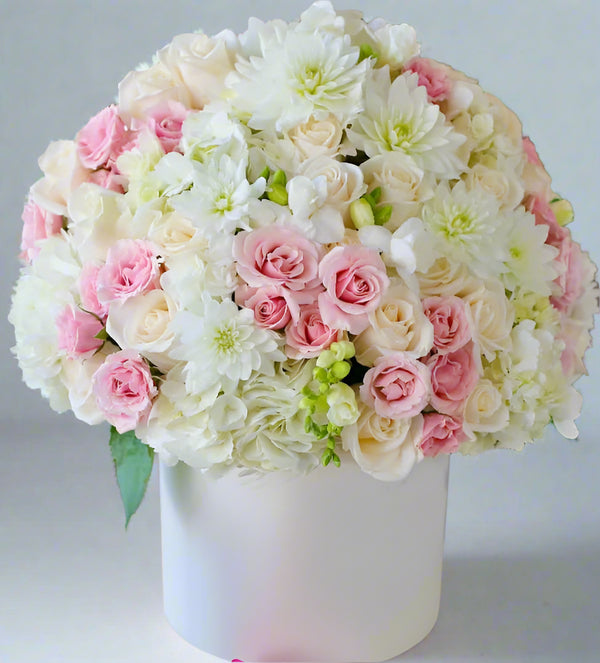 Blushing Elegance in box by Florist Dubai