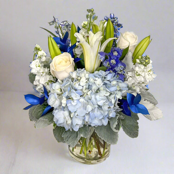 blue hydrangea and white arrangement From Best Florist in Dubai