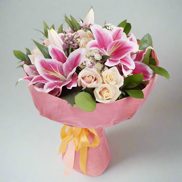 bouquet pinklilies whiteroses From Best Florist Dubai